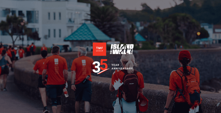 TMF Group Island Walk event celebrating 35 year anniversary with participants walking outdoors.