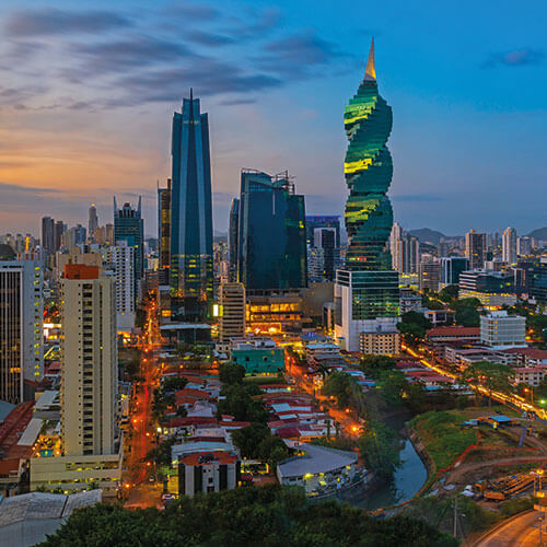 The iconic skyline of Panama City at dusk with the distinctive skyscrapers including the F&F Tower