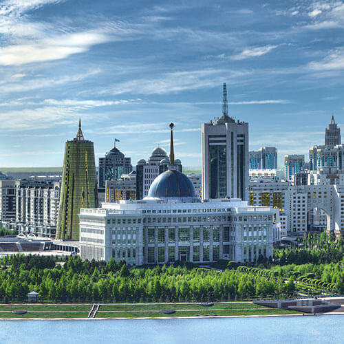 A panoramic view of Nur-Sultan skyline with Ak Orda Presidential Palace, Bayterek Monument, and other landmarks