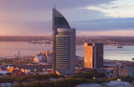 A scenic of Uruguay highlighting the Torre de las Telecomunicaciones a modern skyscraper and the city's waterfront