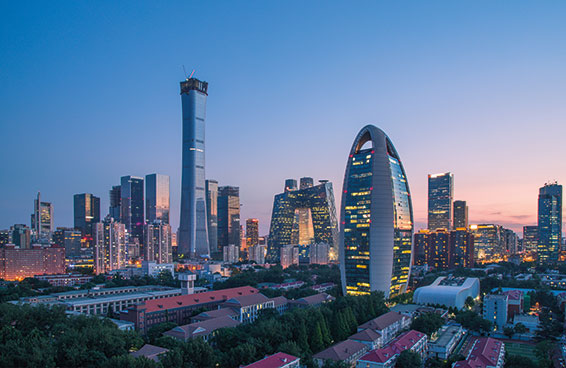 A shot of the Beijing skyline at dusk, with the iconic China World Trade Center Tower III