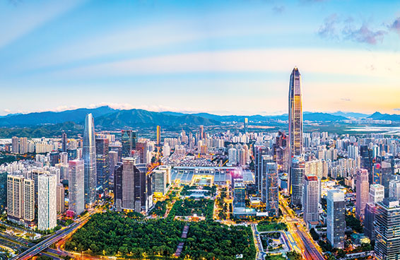 A panoramic view of the Shenzhen skyline at dusk, with the KK100 skyscraper