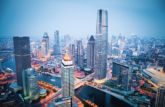 A scenic view of the Tianjin skyline at dusk, with the Haihe River flowing through the city