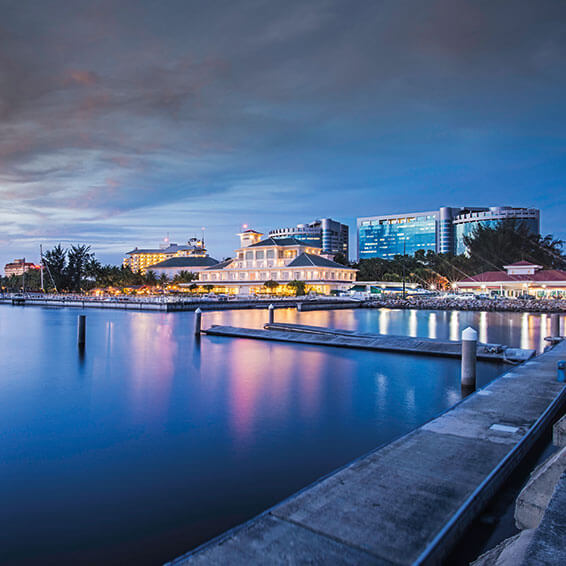 A stunning shot of the Labuan Waterfront at twilight, with the iconic Labuan International Financial Centre in the background