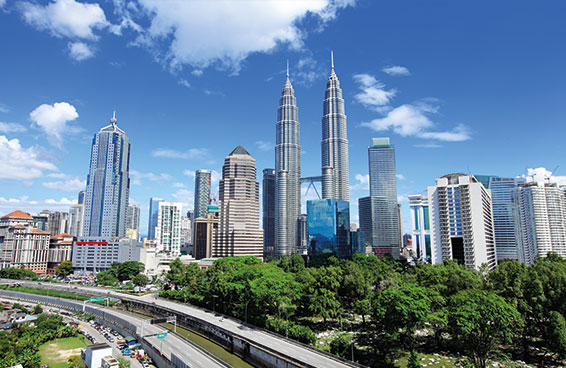 A panoramic view of the Kuala Lumpur skyline with Petronas Twin Towers