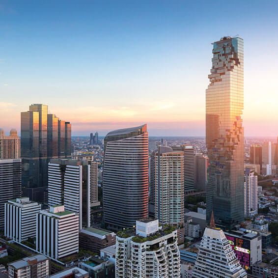 A scenic view of the Bangkok, Thailand, featuring the the iconic MahaNakhon skyscraper at sunset