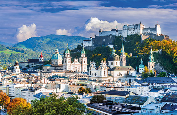 A scenic view of Salzburg, Austria, with the Hohensalzburg Fortress dominating the skyline