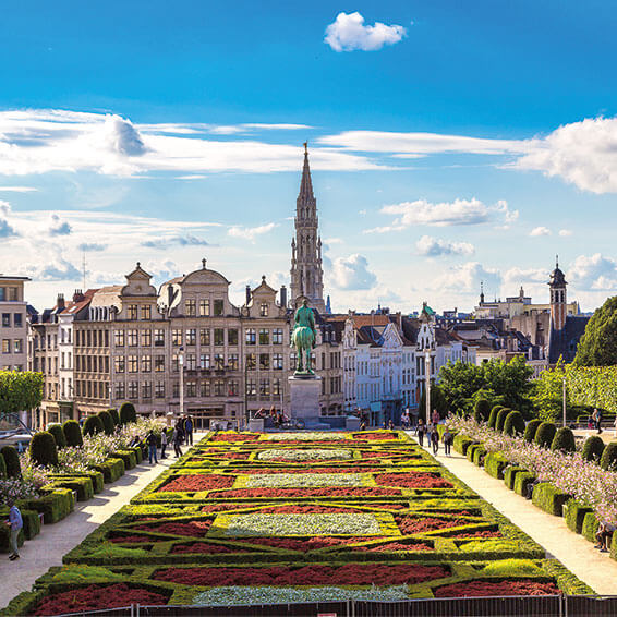 A stunning image of the Mont des Arts in Brussels, featuring a statue of King Albert I and the Brussels Town Hall in the background