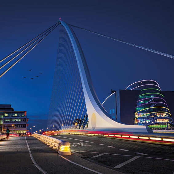 A stunning night shot of the Samuel Beckett Bridge in Dublin with the Convention Centre Dublin in the background