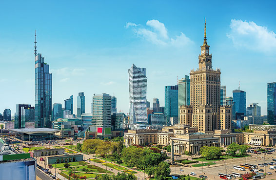 A scenic view of the skyline of Warsaw, Poland, with the Palace of Culture and Science and other modern skyscrapers