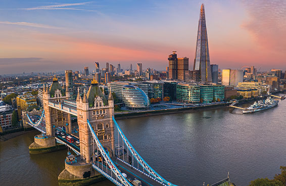  A view of London at sunset, with the Tower Bridge and the Shard in the foreground