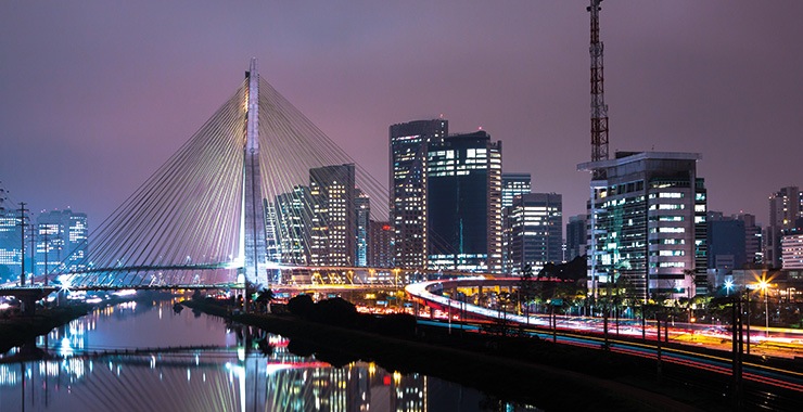 A stunning night shot of the Octavio Frias de Oliveira Bridge in São Paulo Brazil and the city skyline