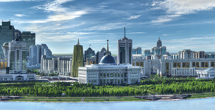 A panoramic view of Nur-Sultan skyline with Ak Orda Presidential Palace, Bayterek Monument, and other landmarks