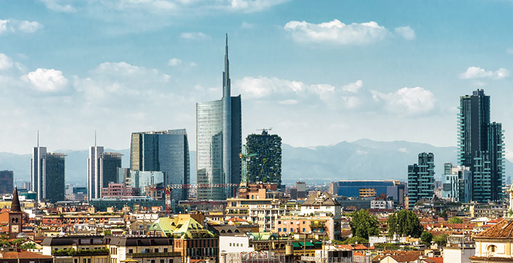 A panoramic view of Milan's skyline, featuring modern skyscrapers like the Torre Unicredit and Bosco Verticale