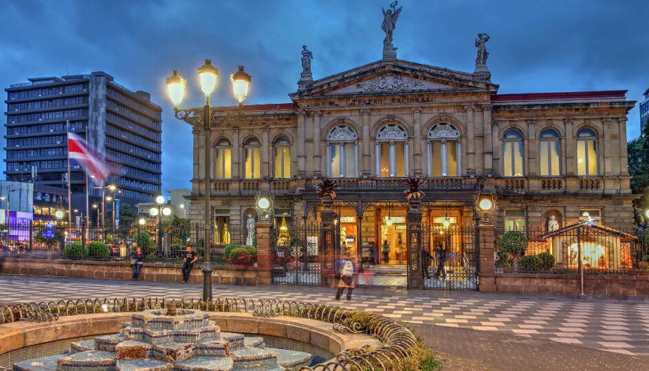 The National Theater of Costa Rica, a grand neoclassical building illuminated at night in San José