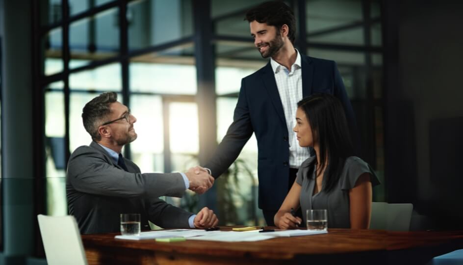 tmf group two business men shaking hands